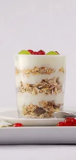 A delicious yogurt parfait with granola and fresh fruit topping.