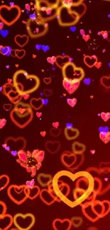 Vibrant wallpaper with glowing hearts and butterfly elements on a red background.