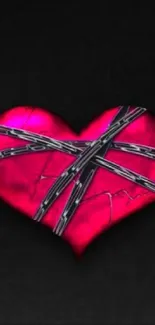 Red heart with metal chains on a dark background wallpaper.