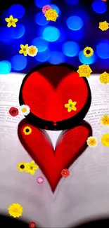 Red heart and flowers on open book with blue bokeh background.