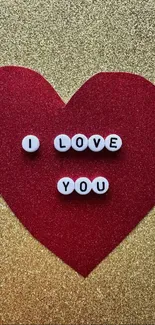 Red heart with I Love You message on gold background