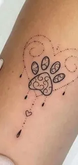 Heart and paw tattoo on arm with minimal design.