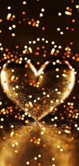 Glowing heart shape surrounded with golden sparkles on a dark background.