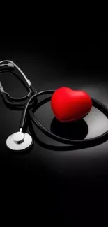 Red heart and stethoscope on dark background wallpaper.