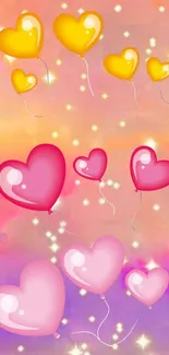 Heart-shaped balloons in pink and yellow on dreamy sunset backdrop.