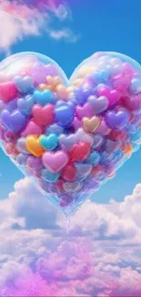 Heart-shaped balloon made of colorful balloons in a blue sky with clouds.