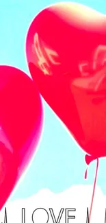 Red heart balloons float in blue sky.