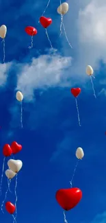 Heart balloons float in a vibrant blue sky, creating a whimsical wallpaper design.