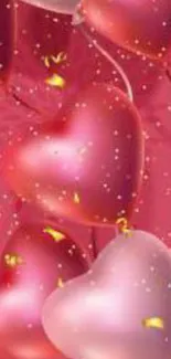 Heart-shaped pink balloons with golden confetti on a mobile wallpaper.