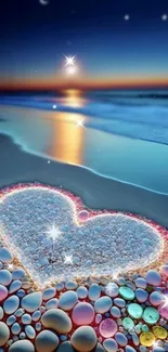 Heart-shaped pebble design on a beach with a sunset and stars.