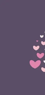 Mobile wallpaper with pink hearts on a dark purple background.