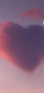 A heart-shaped cloud with crescent moon in a twilight sky.