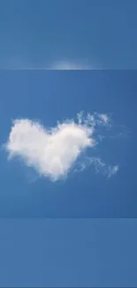 Heart-shaped cloud in a vibrant blue sky.