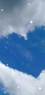 Heart-shaped cloud in a blue sky with fluffy white clouds.