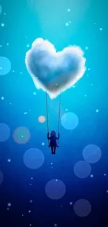 Heart-shaped cloud with swing hanging in a deep blue sky background.