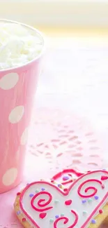 Pink heart cookies and coffee in polka dot cup.