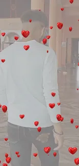 Mobile wallpaper with floating red hearts and a figure in white.