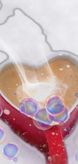 Heart-shaped cup with latte and floating bubbles.