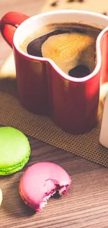 Heart-shaped coffee cups with colorful macarons on a wooden table.