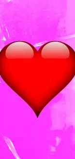 Glossy red heart on a pink textured background.