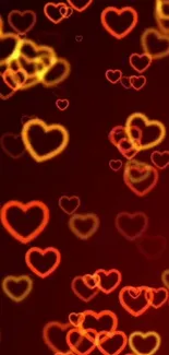 Vibrant red and yellow glowing hearts on a dark background wallpaper.