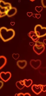 Glowing red and yellow heart shapes on a burgundy background.