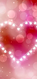 Heart-shaped glowing lights on pink background.