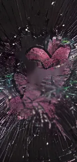 A pink heart in shattered glass on a dark background.