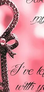 Romantic heart key in pink hues with decorative script on a mobile wallpaper.