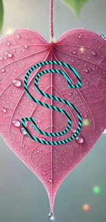 Pink heart-shaped leaf with monogram 'S'.