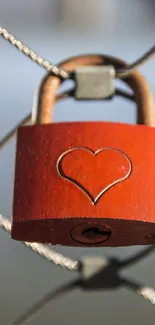 Red heart lock mobile wallpaper on wire fence.