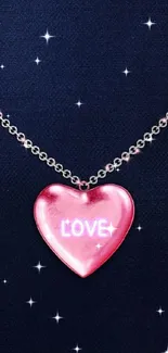 Pink heart necklace with love text on dark background.