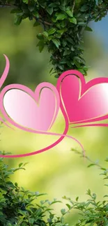 Intertwined pink hearts over lush green leaves.