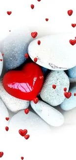 Red heart on smooth pebbles in minimalist wallpaper design.