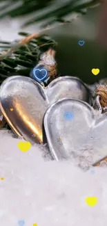 Heart ornaments nestled in snowy background with yellow and blue accents.