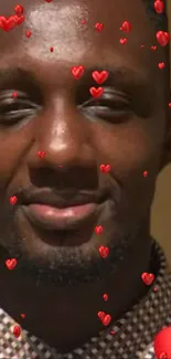 Portrait of a man with red heart overlay on wallpaper.