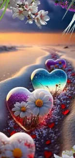 Colorful heart-shaped stones on a sandy beach with flowers.