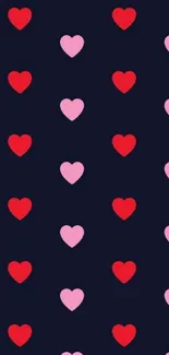 Dark mobile wallpaper with pink and red hearts pattern on a navy background.