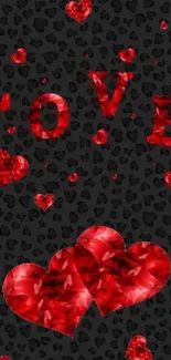 Red hearts and 'Love' on black background wallpaper.