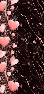 Pink hearts on black marble background.