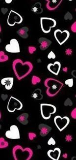 Colorful heart pattern wallpaper in pink, black, and white tones.