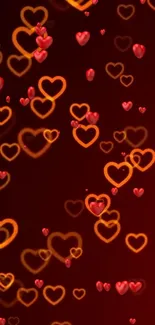 Vibrant heart pattern wallpaper with glowing hearts on a dark red background.