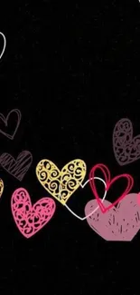 Mobile wallpaper with colorful heart patterns on a black background.