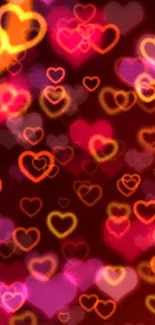 Vibrant heart-patterned wallpaper with glowing red and orange hearts.