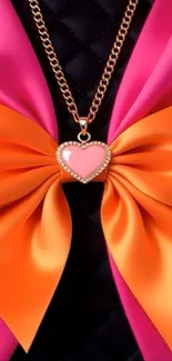 Elegant heart pendant with orange bow and gold chain.