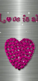 Heart-shaped pink petals on metallic wallpaper with 'Love is all' text.