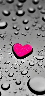 Pink heart amidst raindrops on monochrome background