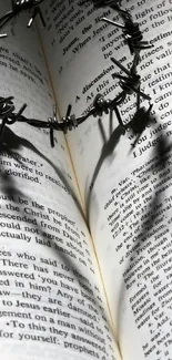 Heart-shaped shadow on open book pages, creating a striking visual effect.