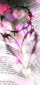 Heart shadow created by thorns on open book pages.