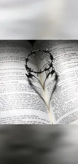 Heart-shaped shadow on open book pages, symbolizing love and reading.